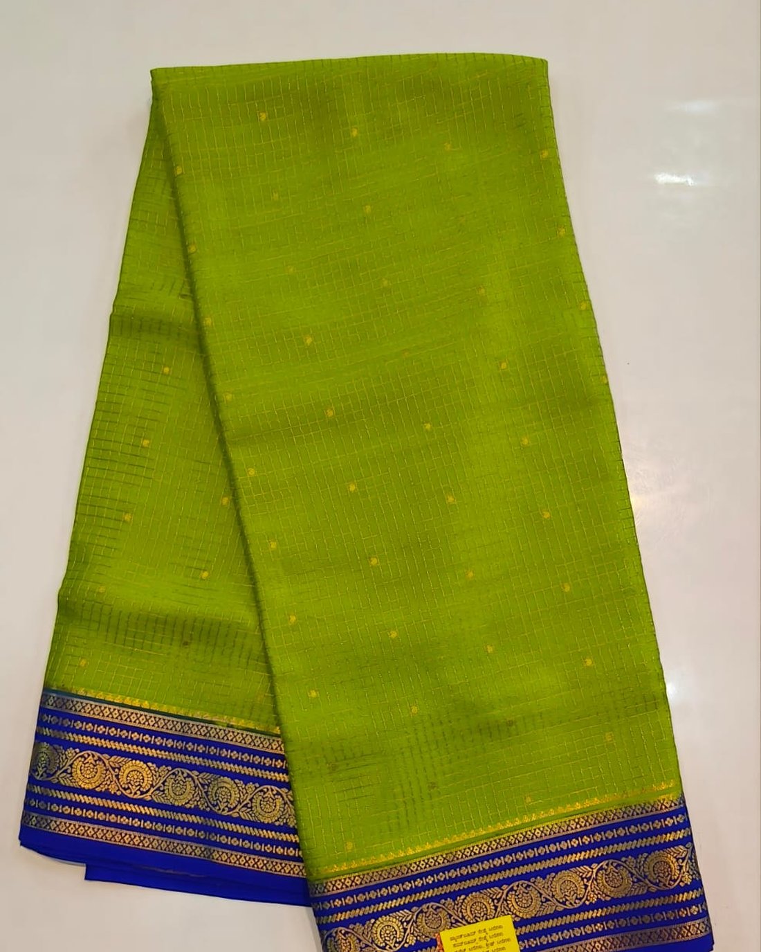 Parrot green pure Mysore silk crape saree with royal blue and gold zari border