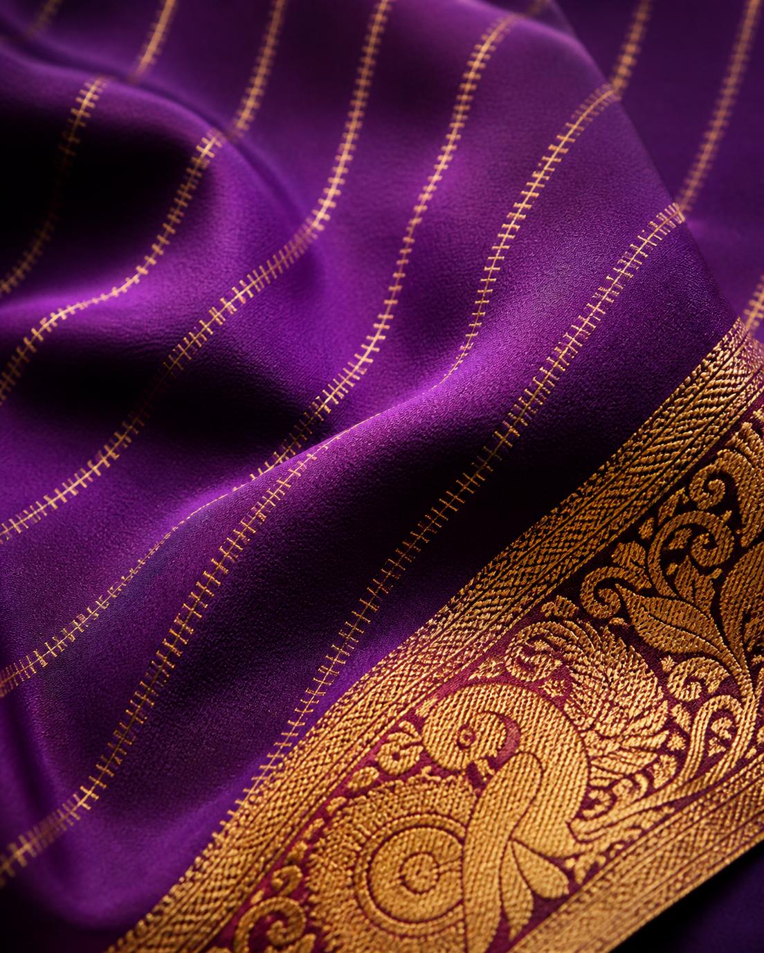 Close detail of gold zari zigzag weave and peacock border on a pure Mysore silk crape saree